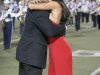 Carlos Alvares walks his daughter, Maya Alvarez, towards the homecoming court during the Crescenta Valley High School Home Coming Game. (Photo by Ed Hamilton / oct26, 2012)