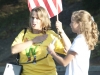 Karen Stegman, principal of Dunsmore Elementary, leads the assembly in pledge of allegiance. With help from Elizabeth Peterson, the student council president.